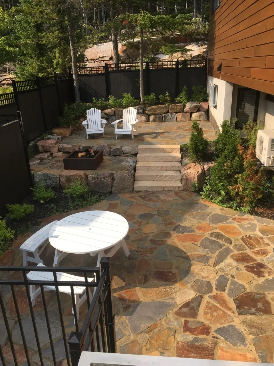 Flagstone patio with fire pit and outdoor furniture